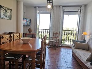 a living room with a table and a couch at Mirador de la Campiña in Cazorla +46 photos