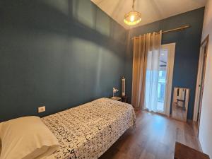 a bedroom with a bed with a white bedspread at Loft industrial a 45min Playas de Doñana Home Torremirador in Villalba del Alcor