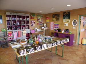 a store with a table with books on it at Les Roulottes des Korrigans in Brasparts