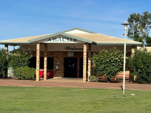a building with a sign on the front of it at Abacus Motel in Mount Isa