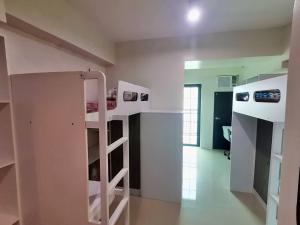 a room with two bunk beds in a room at Dorm in Katipunan - Upper Bunk Bed in Manila