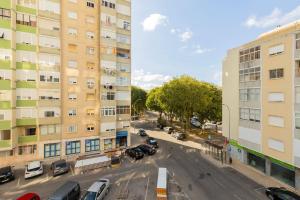 an aerial view of a street between two buildings at Benfica City Flat Stay By Perfect Getaway in Damaia