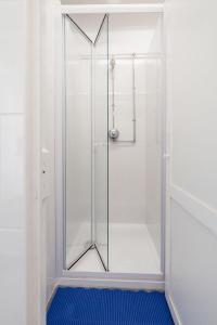 a shower with a glass door in a bathroom at IEC Campus for Groups in Kanturk +46 photos