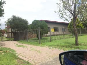 a fence in front of a house at 10 on the De Villiers Caravan in Winburg
