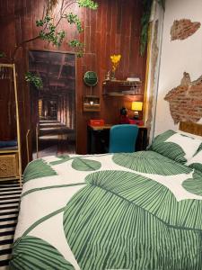 a bedroom with two beds with green and white sheets at New York Loft & Japanese Magic by V4SKIN in Bangkok