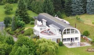 an aerial view of a house with a gambrel roof at Sluneční apartmán in Turnov