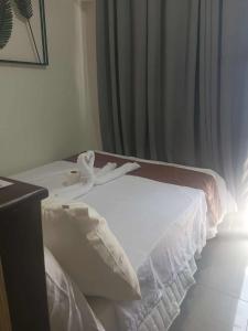 Ένα ή περισσότερα κρεβάτια σε δωμάτιο στο SHORE Staycation in MOA by MLG +17 φωτογραφίες