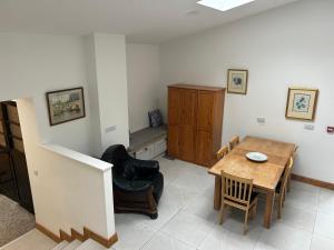 a room with a table and chairs and a dining room at IEC Campus for Groups in Kanturk