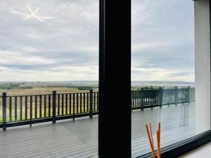 a view from the balcony of a house at Lewis Living in Aird Tong