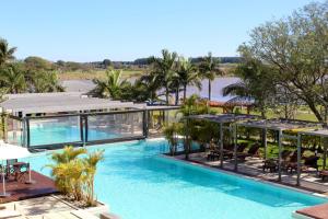 an image of a swimming pool at a resort at Arena Resort in Federación