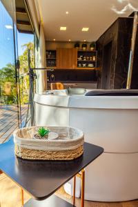 a kitchen with a table with a pineapple on it at Rancho Carolina Cabana Panther in Rancho Queimado