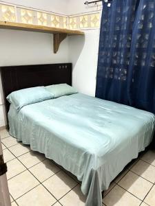 Ένα ή περισσότερα κρεβάτια σε δωμάτιο στο Casita en la playa