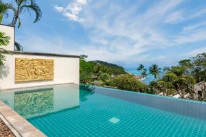 an infinity pool at a villa with a view of the ocean at The Retreat, Pool & Sea View Villa in Koh Samui 