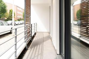 a balcony with a view of a street at Beautiful apartment near CHIO Tivoli incl underground parking in Würselen