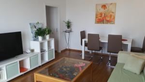 a living room with a tv and a fish tank at Panorama Apartment in Zadar