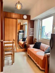 Ένα ή περισσότερα κρεβάτια σε δωμάτιο στο SMDC Coast Residences Booking unit- Ana D'arcy Staycation