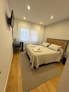 En eller flere senge i et værelse på Aires de Pontevedra