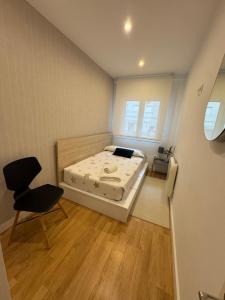 En eller flere senge i et værelse på Aires de Pontevedra