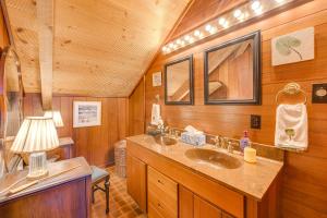a bathroom with two sinks in a wooden cabin at Pet-Friendly Gem with Private Dock in Deltaville! in Deltaville +32 photos