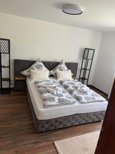a bedroom with a large bed with pillows at Cozy apartment in Sankt Goar