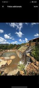 a picture of a river on a rocky hill at Chalés Novo Horizonte in Natividade do Carangola