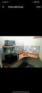 a picture of a bathroom with a sink at Chalés Novo Horizonte in Natividade do Carangola