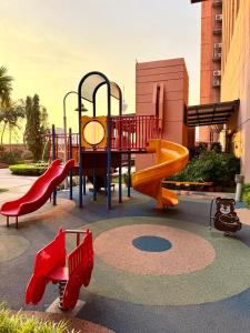 a playground with a slide and a slideintend at Elements Service Suites Time Square kl in Kuala Lumpur
