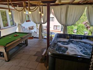 a pool table in a room with a pool table at Casa Destinatia Perfecta in Braşov