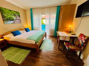 Postel nebo postele na pokoji v ubytování Pension am Campus Velden + 24 fotografií