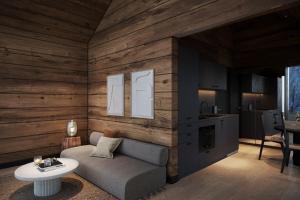 a living room with a couch and a table at Levi Nordic Star Igloos in Kittilä