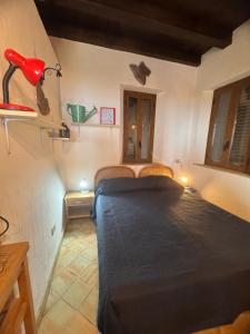 Postel nebo postele na pokoji v ubytování Casa Vacanze Bombolino