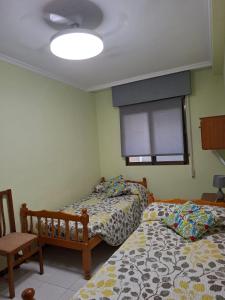 En eller flere senge i et værelse på Magic World + 5 billeder