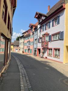 an empty street in a town with buildings at Black Forest apartment in Rottweil in Rottweil
