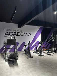 a group of exercise bikes parked next to a wall at Studio BQ 3 in Barbacena