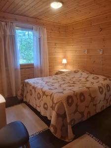 Postel nebo postele na pokoji v ubytování Villa Goahti - Kantokelo