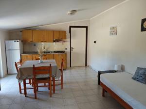 a kitchen and dining room with a table and chairs at La Pagoda in Gizzeria +57 photos