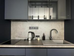 Η κουζίνα ή μικρή κουζίνα στο Smarty Choice Living with Netflix - Kubánské náměstí