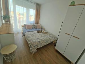 Postel nebo postele na pokoji v ubytování Sky Hai Apartment