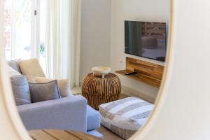 TV a/nebo společenská místnost v ubytování Casa Palm, 1 slaapkamer appartement in Jan Thiel met zwembad