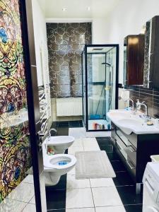 a bathroom with a toilet and a sink at Private room in the Centre in Prague