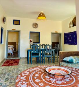 a living room with a table and a dining room at Sunrise Camp in Mirleft +31 photos