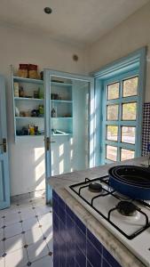 a kitchen with a stove and a counter top at Villa Mozia riserva dello Stagnone in Marsala