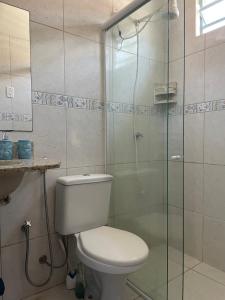 a bathroom with a toilet and a glass shower at Casa Arakyssawa in Salvaterra +13 photos
