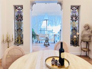 a room with a table with a bottle of wine at Trevi Fountain Elegant Suites by Marianna in Rome