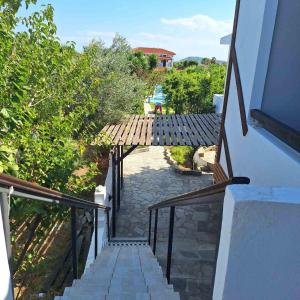 an external stairway leading up to a house at Petite Economy Lodge in Skiathos