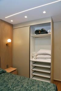 En eller flere senge i et værelse på Moderno ao lado do Shopping