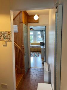 a hallway leading to a bedroom in a house at Cozy flat in Leafy Greenfields in Galway