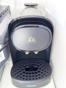 a close up of a toaster sitting on a shelf at Proche centre et calme - cozy - parking privé en résidence in Colmar