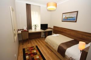 Postel nebo postele na pokoji v ubytování My Rose Hotel