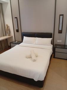 Ένα ή περισσότερα κρεβάτια σε δωμάτιο στο Luxury Suites By Lucentia Residences BBCC